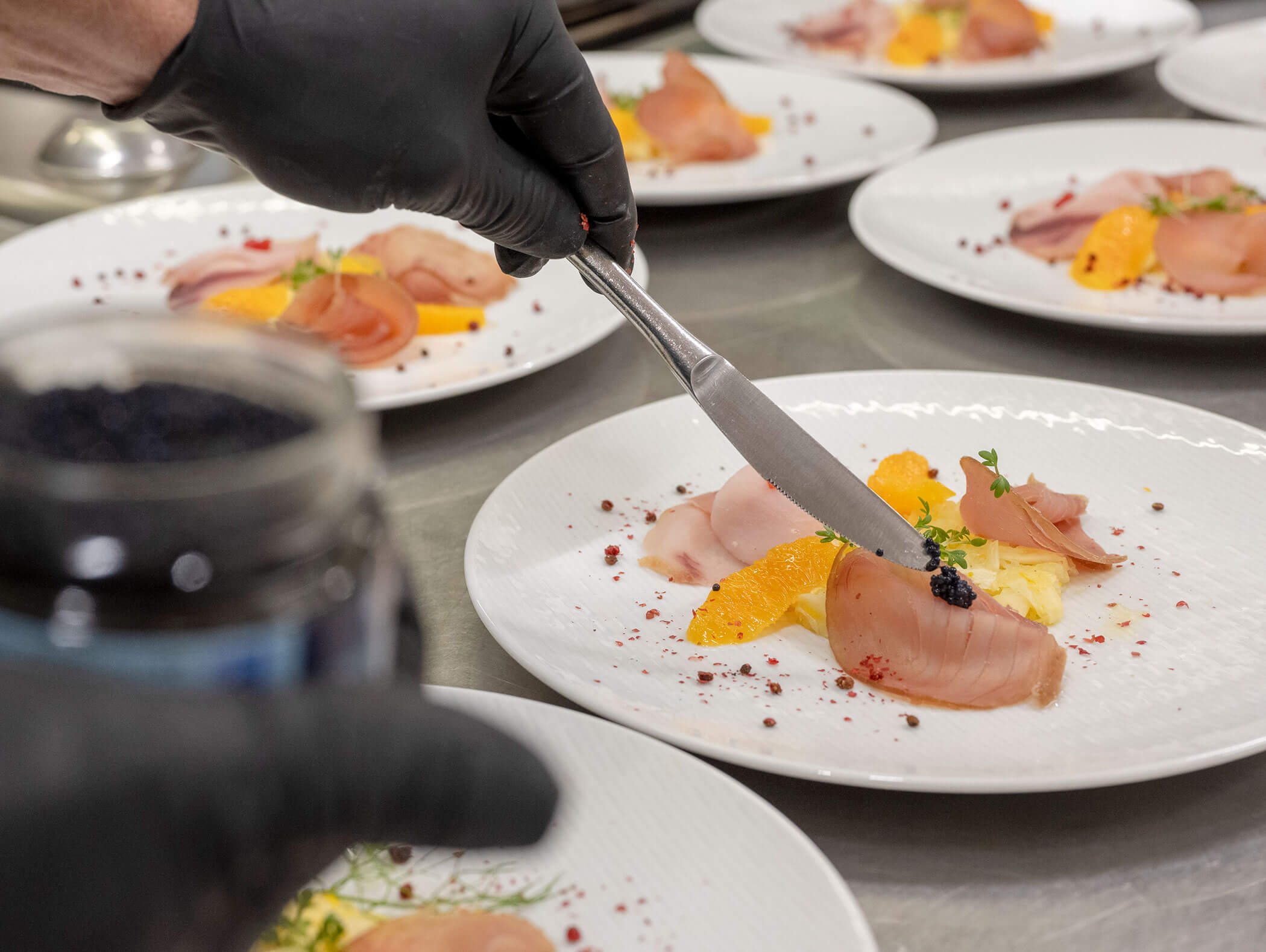 Chef prepares the plates